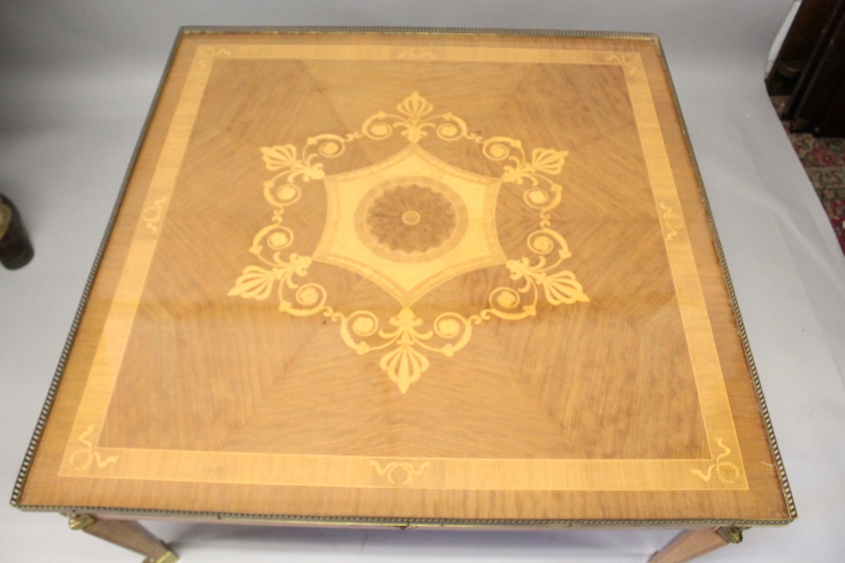 A LOUIS XVITH SQUARE TOP COFFEE TABLE, with inlaid topand brass grill on Egyptian brass legs with - Image 4 of 5