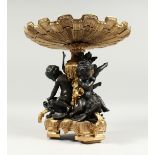 A SUPERB BRONZE AND GILT BRONZE TAZZA with three cupids holding a shell. 13ins long.