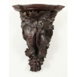 A BLACK FOREST CARVED WOOD WALL BRACKET, game, grapes and leaves. 23ins high