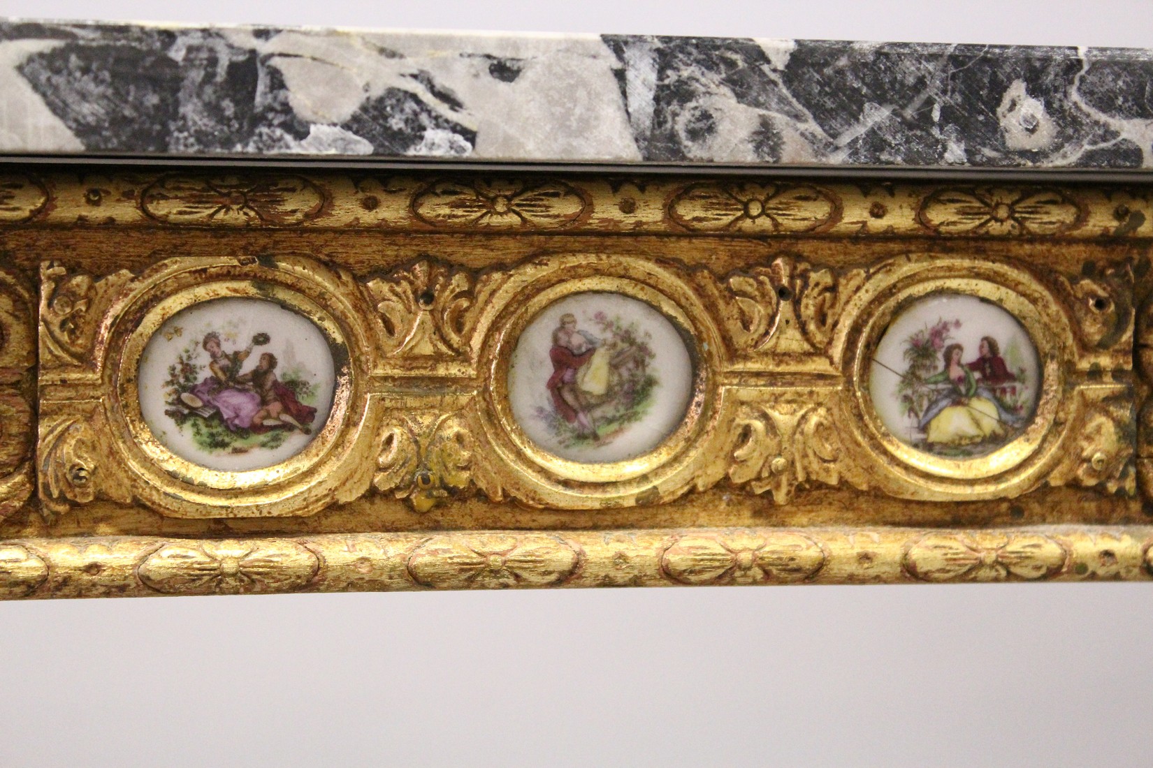 A SMALL GILDED SIDE TABLE, with marble top porcelain panels on turned tapering legs. 2ft long - Image 3 of 7