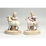 A GOOD PAIR OF 19TH CENTURY MEISSEN PORCELAIN GROUPS, a young boy with a goat and a girl with a