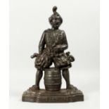 AN AMUSING CAST IRON DOOR STOP "DON'T YOU TELL" 17ins high.