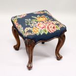 A VICTORIAN ROSEWOOD SQUARE TOP STOOL with floral needlework on cabriole legs. 1ft 1ins long.