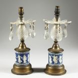 A GOOD PAIR OF WEDGWOOD BLUE AND WHITE LUSTRES with prism drops 11ins higH.