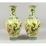 A GOOD PAIR OF CHINESE YELLOW DRAGON VASE 17ins high.