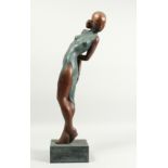 AN ABSTRACT BRONZE FIGURE OF A YOUNG LADY WEARING A DRESS, on a pedestal base. 25.5ins high