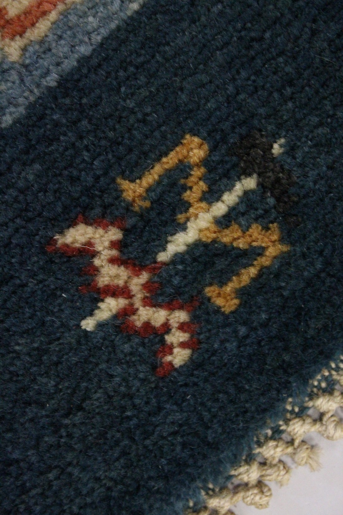 MORRIS & CO., HAMMERSMITH STUDIO, a small wool rug, blue ground, the central rectangular panel woven - Image 2 of 3