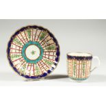 A WORCESTER COFFEE SUP AND SAUCER of fluted form painted with a blue, turquoise and gold version