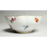 A GOOD MEISSEN CIRCULAR SUGAR BOWL with waved gilt edge and painted with flowers. Cross swords