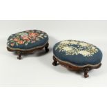 A GOOD PAIR OF VICTORIAN MAHOGANY OVAL FOOT STOOLS with needlework tops on cabriole legs. 14ins