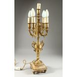 A 19TH CENTURY ONYX AND GILT METAL FIVE LIGHT CANDLELABRA on a square stepped base.