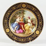 A GOOD VIENNA CIRCULAR PLATE, blue and gilt border, the centre painted with a classical scene
