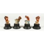 FOUR CARVED TERRACOTTA STUDIES OF HANDS in various poses. 4.5ins high.