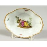 AN 18TH CENTURY MEISSEN PORCELAIN OVAL DISH edged in gilt and painted with a lady sleeping. Cross