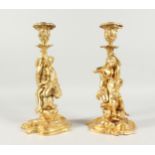 A VERY GOOD PAIR OF GILT BRONZE CLASSICAL FIGURAL CANDLESTICKS. 12ins high.