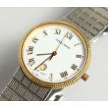 A GENTLEMAN'S 18CT GOLD AND STEEL, DANIEL MINK WRIST WATCH