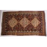 A GOOD LARGE EARLY 20TH CENTURY QASHQAI CARPET with three central diamond shaped, decorated all over