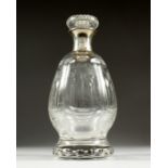 AN ASPREY CUT GLASS DECANTER AND STOPPER with silver band.