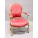 A GEORGE III ARM CHAIR, with padded back, arms and seat on cabriole legs.