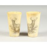 TWO SCOTTISH HORN DRINKING CUPS engraved with deer 4.5ins