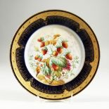 A SEVRES CIRCULAR PLATE with blue and gilt border, the centre painted with strawberries, signed by