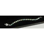 A SILVER OPAL SNAKE'S HEAD LINE BRACELET