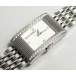 A GOOD DIAMOND SET BOUCHERON WATCH No. 090-3067 in original pouch