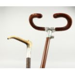 A SWAIN-BRIGG SHOOTING STICK and a bone handled whip.(2). 34ins long.