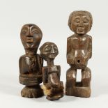THREE ANCIENT TRIBAL CARVED WOOD DOLLS 8ins high
