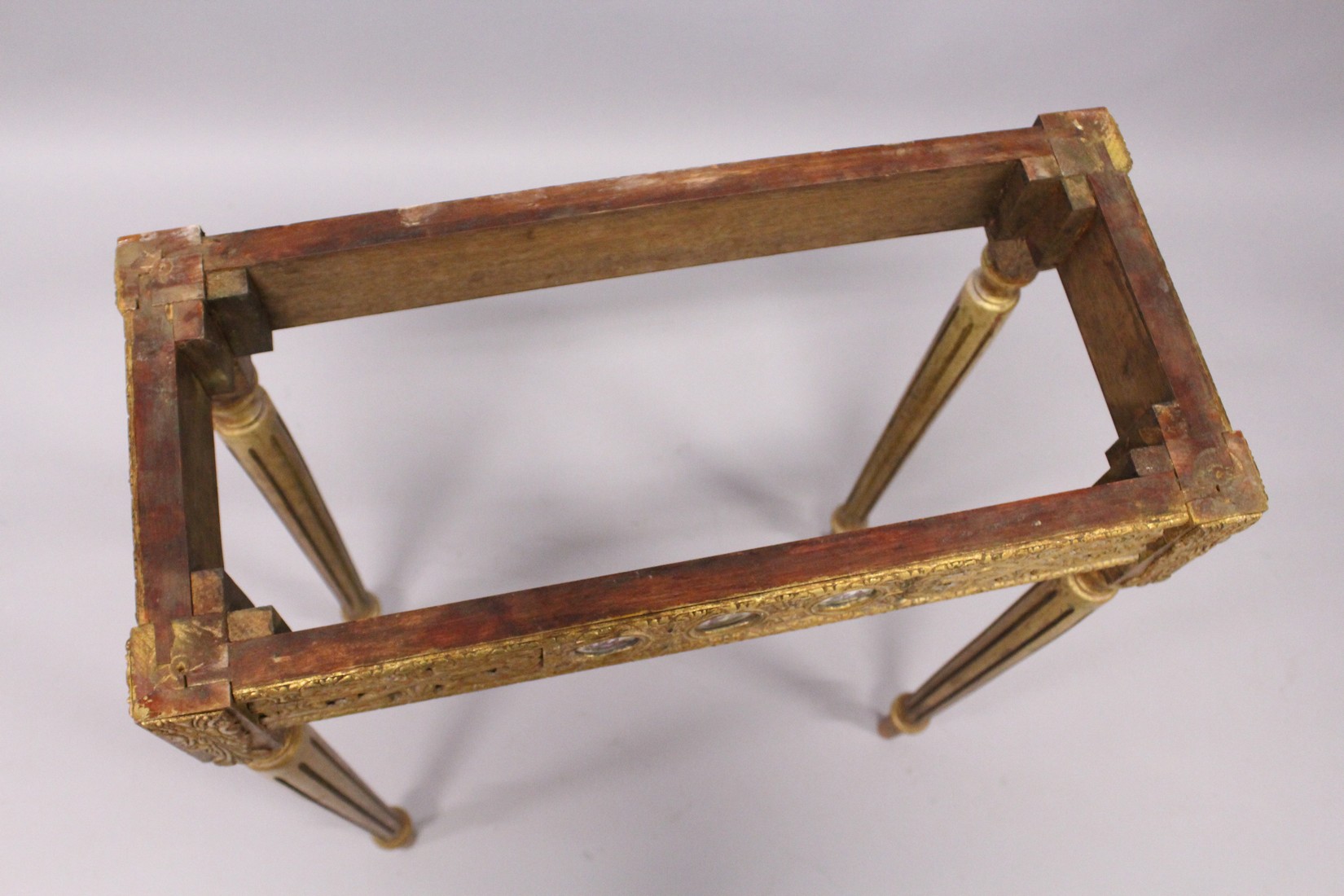 A SMALL GILDED SIDE TABLE, with marble top porcelain panels on turned tapering legs. 2ft long - Image 6 of 7