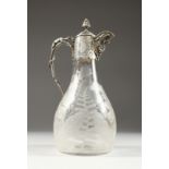 A VICTORIAN ETCHED GLASS CLARET JUG with plated mounts