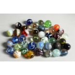 A COLLECTION OF FORTY VARIOUS COLOURED MARBLES 1-1.5cm