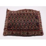 A PERSIAN CUSHION 2ft 6ins x 1ft 6ins