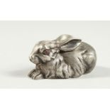A SMALL RUSSIAN SILVER RABBIT with ruby eyes, stamped head, '84 Faberge'