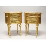 A PAIR OF FRENCH STYLE GILT WOOD OVAL THREE DRAWER BEDSIDE CHESTS, with marble tops. 2ft 3ins high x