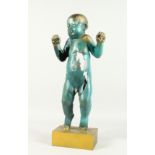 AN ABSTRACT BRONZE BROKEN STANDING BABY on a gilt metal base. 24ins high