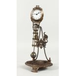 A SMALL BRONZE MYSTERY CLOCK WITH DISH BELOW. 10.5ins high.