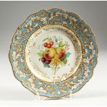 AN ENGLISH PORCELAIN PLATE, light blue and gilt border, the centre painted with fruit 9ins