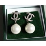 A PAIR OF CHANEL STYLE PEARL DROP EAR RINGS