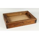 A GRADUATED SET OF THREE PINE TRAYS 'VEUVE CLICQUOT', largest tray 1ft 10ins long