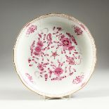 A GOOD MEISSEN CIRCULAR DEEP DISH with waved gilt edge and painted with pink flowers Cross swords