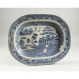 A WILLOW PATTERN BLUE AND WHITE DISH 16ins long.