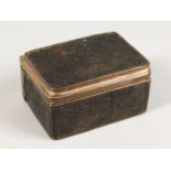 AN 18TH CENTURY TORTOISESHELL BOX AND COVER with musical trophies in relief. 3ins.