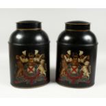 A PAIR OF OVAL TOLEWARE BINS and lids with coat of arms. 13ins high