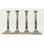 A SET OF FOUR CLUSTER COLUMN OF CLASSIC DESIGN on square loaded bases. 13ins high