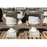 A SUPERB NEAR PAIR OF ITALIAN CARVED WHITE MARBLE URNS ON STANDS, the sides covered with dancing