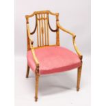 A SHERATON SATINWOOD PAINTED ARM CHAIR, with railed back, padded seat on tapering legs.