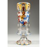 AN ARMORIAL ENAMEL GLASS. 8.5ins high.