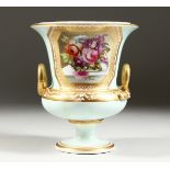 A DERBY COMPOUND TWO HANDLED URN, painted with a panel of flowers. 6.5ins high. AF