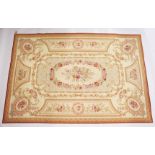 AN AUBUSSON STYLE TAPESTRY WALL HANGING, beige ground with floral decoration. 9ft x 6ft.
